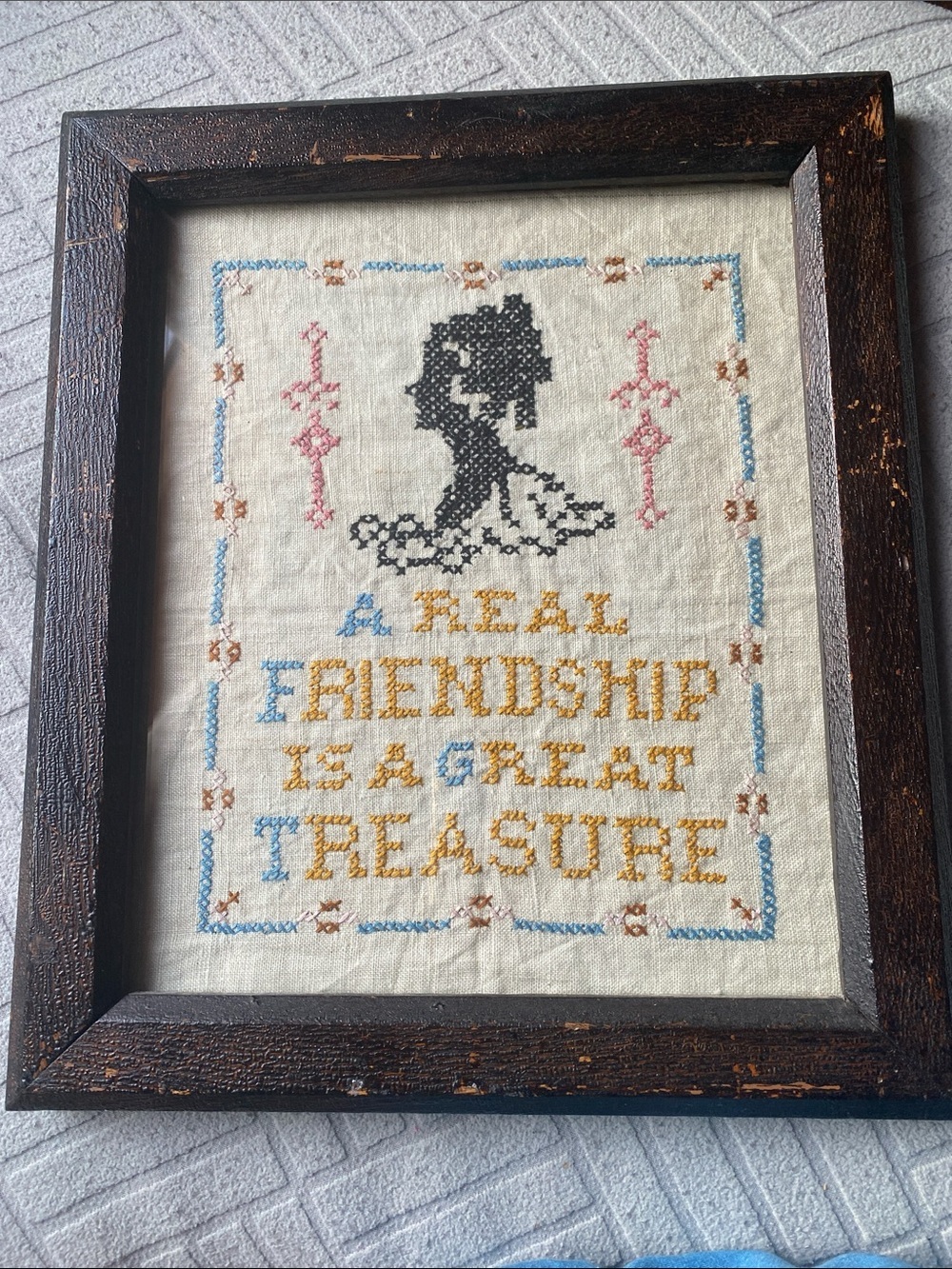 Framed Cross-Stitch "A Real Friendship Is A Great Treasure"